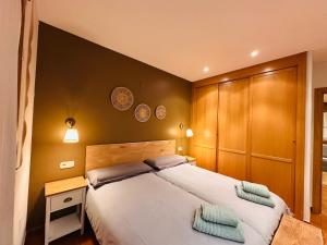 Katil atau katil-katil dalam bilik di Apartamento Acogedor Pineta +12 gambar