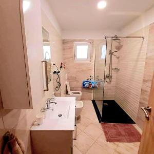 Kúpeľňa v ubytovaní Apartmens Beach house
