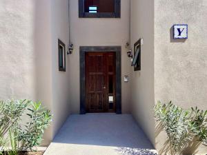 a doorway to a building with a wooden door at EL Colibrí in San Miguel de Allende +58 photos