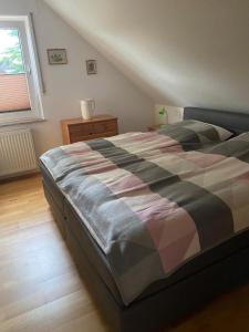 a large bed in a bedroom with a window at Haus Datteln in Datteln