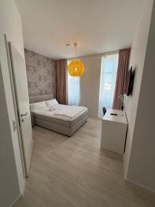 Postel nebo postele na pokoji v ubytování Hotel Astra