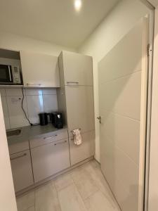Kuchyň nebo kuchyňský kout v ubytování Hotel Astra