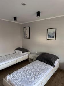 Postel nebo postele na pokoji v ubytování Ośrodek Ustronie w Myczkowcach
