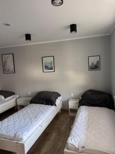 Postel nebo postele na pokoji v ubytování Ośrodek Ustronie w Myczkowcach