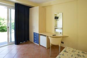A bed or beds in a room at Hotel Vila Bahia