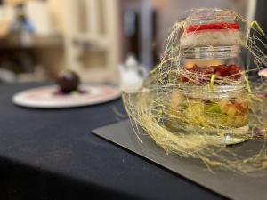 a bird cage with food in it on a table at Riad MALAÏKA in Essaouira