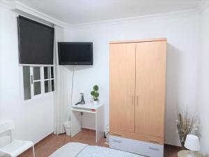 TV a/nebo společenská místnost v ubytování Rincón de Joel Habitación con baño privado