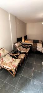a room with three beds and a tiled floor at Economical Hosting Downtown - Hospedagem econômica no centro de Campinas in Campinas