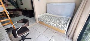 Postel nebo postele na pokoji v ubytování CASA TOP de 2 quartos em TORRES-RS - na mais bela praia Gaúcha - Cozinha - Banheiro - Ar-condicionado split em cada quarto- Smart TV 32' - Wi-Fi- Estacionamento - Anfitriã Superhost no BnB