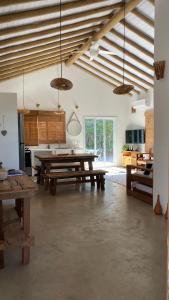 a large room with a table and some windows at Samaya Corumbau in Corumbau
