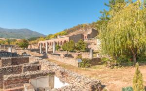 ancient ruins of a building on a hill at Riverside Apartment in Bitola