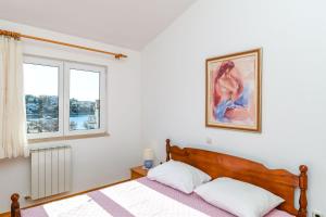 Ένα ή περισσότερα κρεβάτια σε δωμάτιο στο Apartments Vesna +40 φωτογραφίες