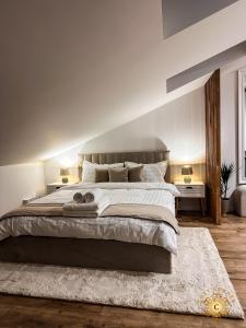 a bedroom with a large bed with a white bedspread at Cozy Corner 2 in Cluj-Napoca