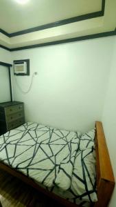 ゼネラル・ルナにあるChana IAOのベッドルーム1室(ベッド1台、ドレッサー付)