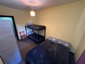 Postel nebo postele na pokoji v ubytování Hostel Punto Patagónico Bariloche