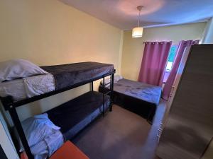 Postel nebo postele na pokoji v ubytování Hostel Punto Patagónico Bariloche