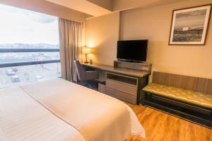 TV a/nebo společenská místnost v ubytování GHL Hotel Bogota Occidente