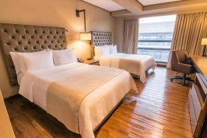 GHL Hotel Bogota Occidente客房内的一张或多张床位