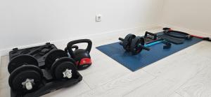 a room with two exercise equipment on the floor at Aparthouse with pool in Solin