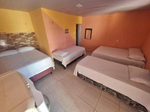Letto o letti in una camera di Pousada Aconchego