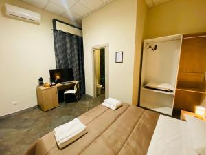 Postel nebo postele na pokoji v ubytování B&B l'angoletto