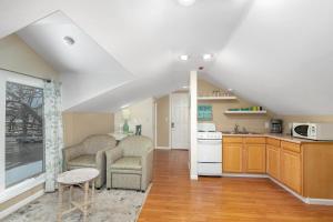 a kitchen with two chairs and a table in a room at Downtown View in Saugatuck