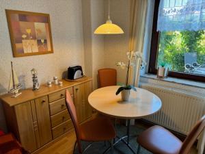 a room with a table and a table and a window at Haus Sonnenschein in Zingst in Zingst