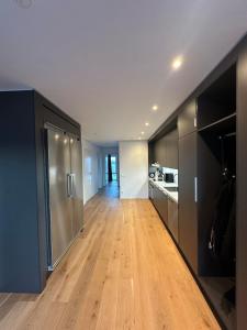 an empty kitchen and living room in a apartment at Luxury Apartment,close to city in Örebro