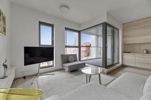 Televízia a/alebo spoločenská miestnosť v ubytovaní Granaria Comfort Apartments