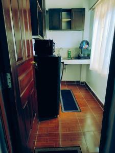 Kuchyň nebo kuchyňský kout v ubytování Ivonhomesuites