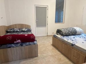 Ένα ή περισσότερα κρεβάτια σε δωμάτιο στο Apartament 3 camere Magurele +1 φωτογραφίες