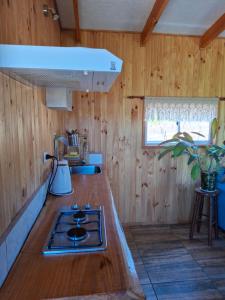 A cozinha ou kitchenette de Cabaña Refugio Magenta