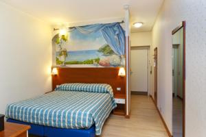 Postel nebo postele na pokoji v ubytování Residence Dei Due Porti