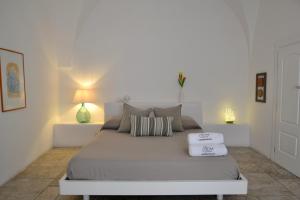 Ein Bett oder Betten in einem Zimmer der Unterkunft Casaterramare