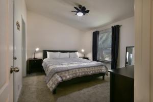 a bedroom with a bed and a ceiling fan at Suter's Forte in Wawona
