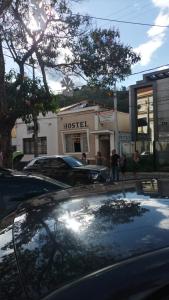 a car is parked in front of a hotel at Hostel Baladi in Socorro