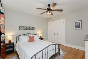 a bedroom with a bed and a ceiling fan at Sojourn at Colley Manor Unit 4 Sleeps 4 in Norfolk