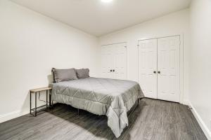 a bedroom with a bed and white walls at Private Hot Tub and Golf Course Views Lakeway Gem in Lakeway