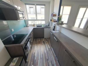 a kitchen with a sink and a counter top at Spacious 1 bedroom apartment near Paris in Garches