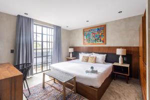 Llit o llits en una habitació de Turquoise Tulum Hotel