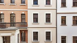 a facade of a building with windows at 2bedroom apartment and condo at Taksim with free parking in Istanbul