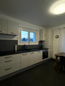 A cozinha ou kitchenette de Séjour calme près du Léman