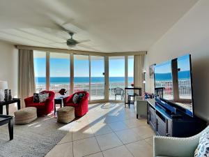 a living room with a view of the ocean at Caribe The Resort #D1114 in Orange Beach