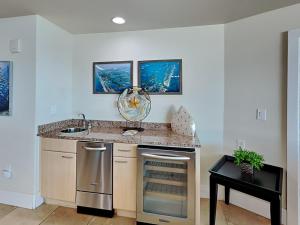 a kitchen with a sink and a counter top at Caribe The Resort #D1114 in Orange Beach +34 photos