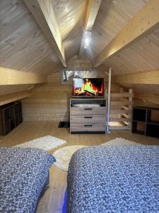 Ένα ή περισσότερα κρεβάτια σε δωμάτιο στο Le Chalet de Françesca
