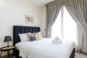 Ένα ή περισσότερα κρεβάτια σε δωμάτιο στο Turquaz Residence