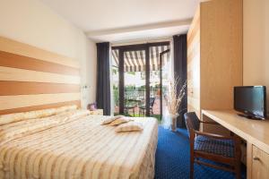 Postel nebo postele na pokoji v ubytování Hotel Ca' Di Valle + 37 fotografií