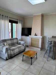 Χώρος καθιστικού στο Excelente CASA 2 quadras do mar