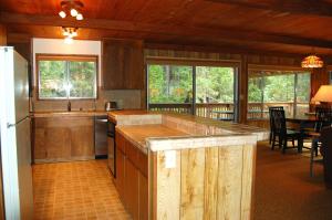 a kitchen with a large island in a house at Mountain Retreat in Wawona