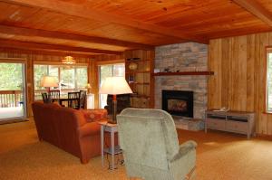 a living room with a couch and a fireplace at Mountain Retreat in Wawona +10 photos